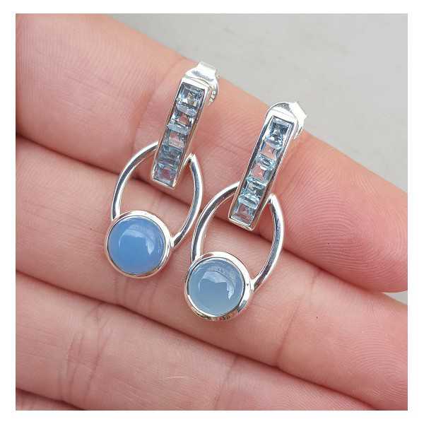 Silver earrings set with blue Topazes and Chalcedony