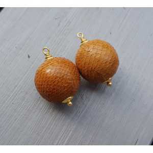 Gold plated pendant set with sphere of orange Snakeskin
