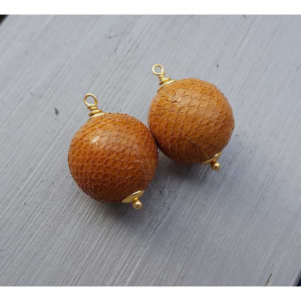 Gold plated pendant set with sphere of orange Snakeskin