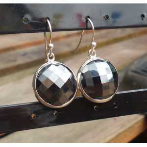 Silver earrings set with round faceted Hematite 