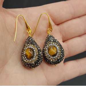 Earrings set with tiger's eye and black crystals