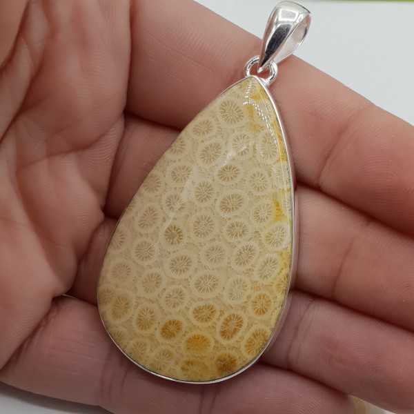 Silver pendant set with large teardrop shaped Fossil Coral