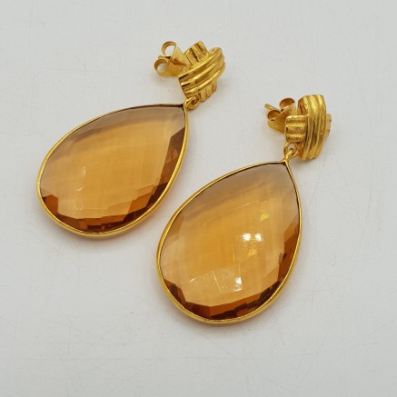 Gilt earrings set with champagne topaz