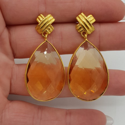 Gilt earrings set with...