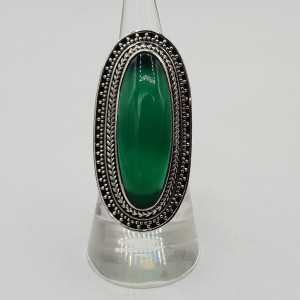 A silver ring set with green Onyx.