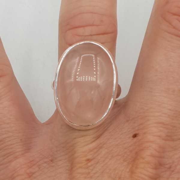 A silver ring set with an oval cabochon rose quartz 17.3 mm