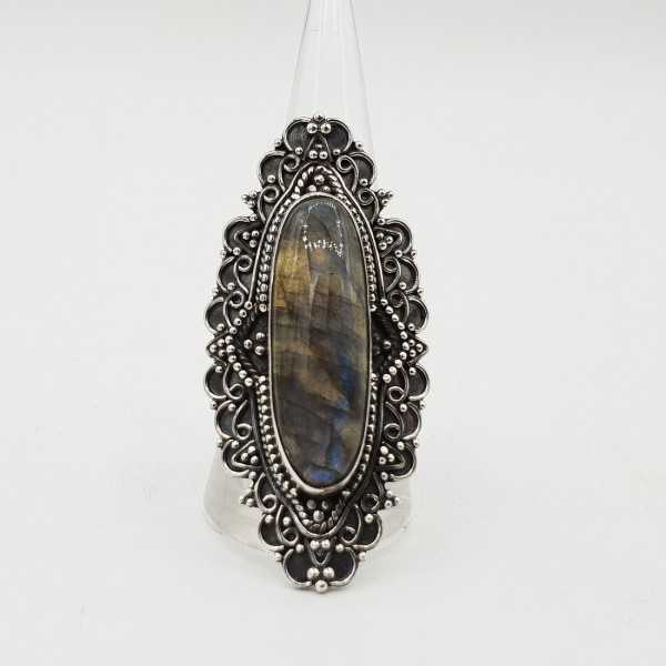 A silver ring with an oval Labradorite in any setting