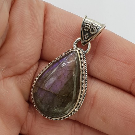 Silver pendant with purple labradorite in edited setting