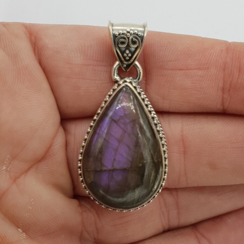 Silver pendant with purple labradorite in edited setting