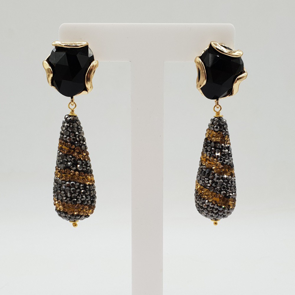 Gilded earrings with a drop of gold and black crystals