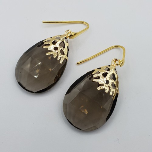 Gilded earrings with wide...