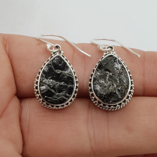 Silver earrings drop -shaped shungite put in edited setting