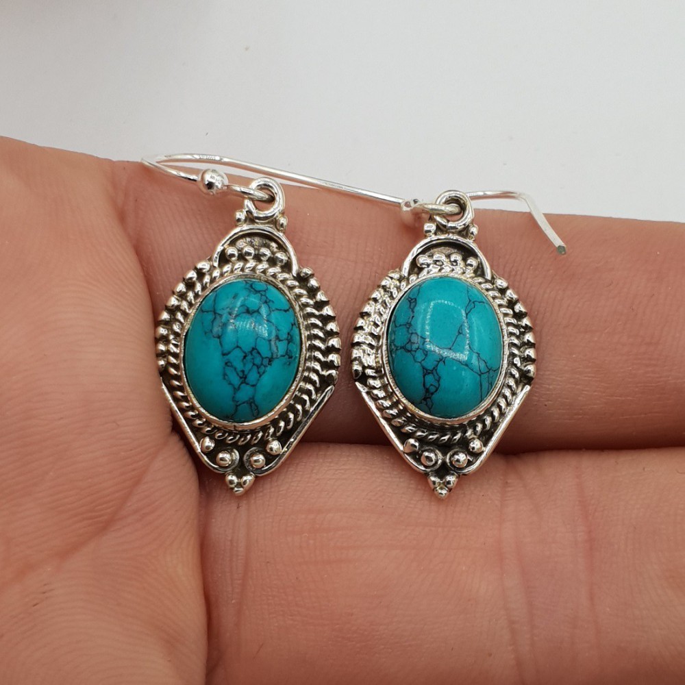 925 Sterling silver earrings set with oval turquoise