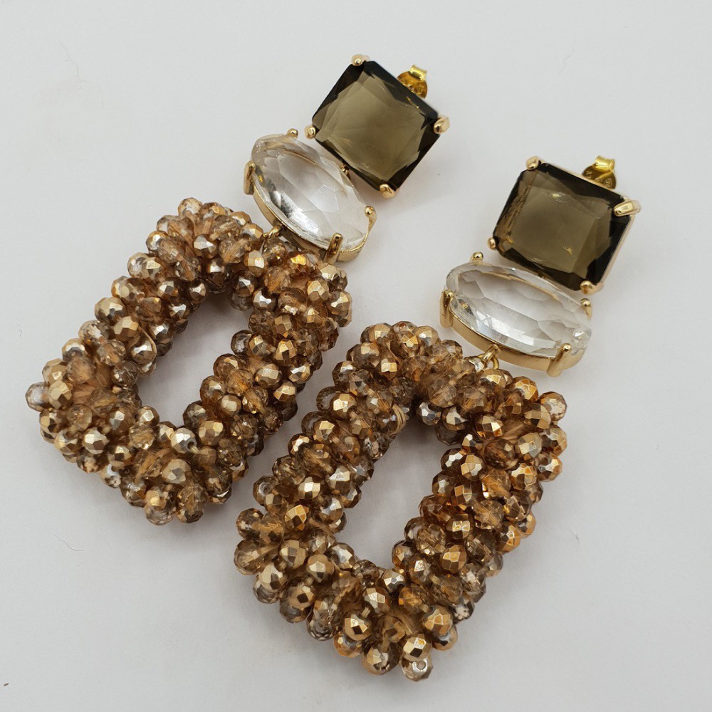 Gilded earrings of golden crystals and crystal