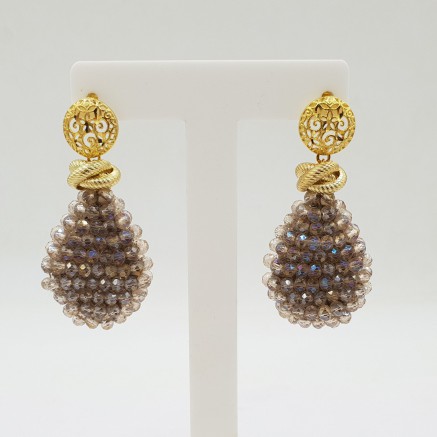 Gilded earrings with flat crystals drop