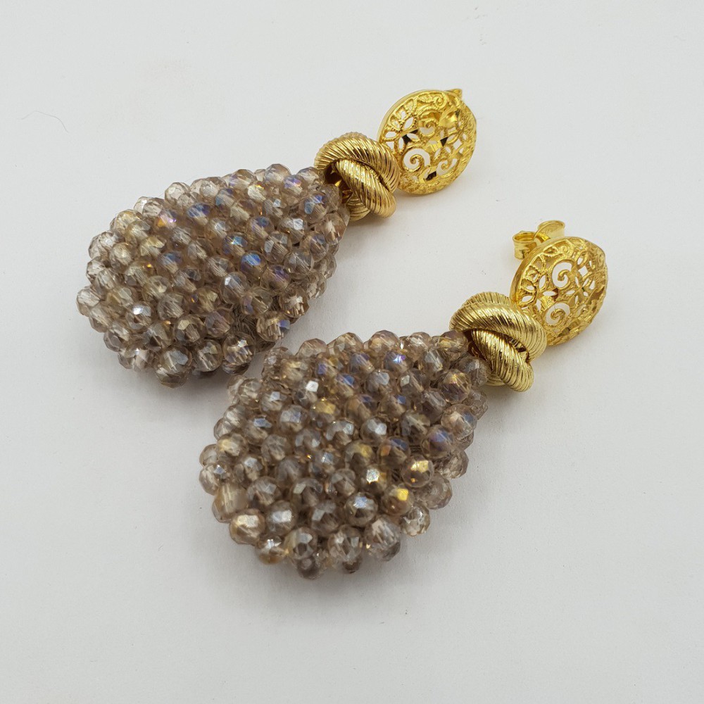 Gilded earrings with flat crystals drop