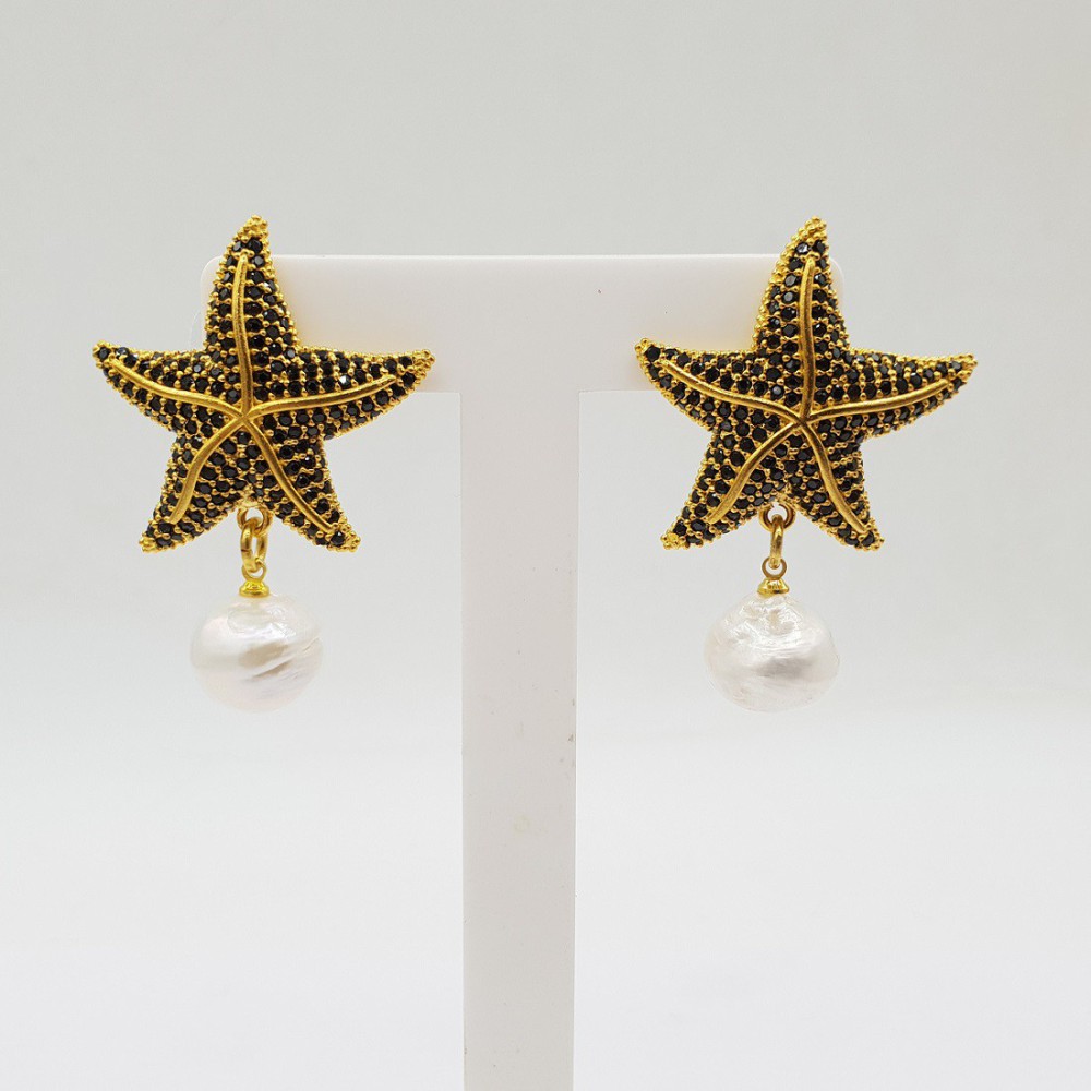 Gilded earrings with starfish and with pearl