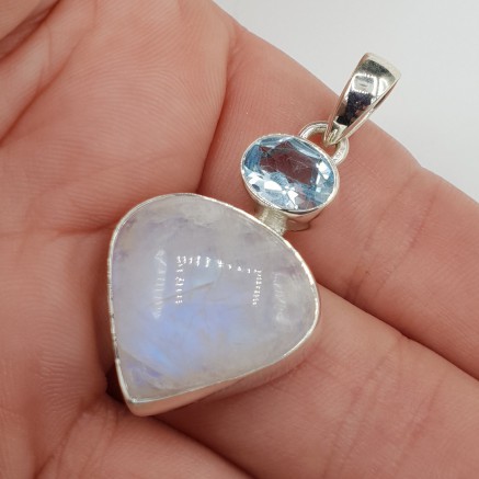 Silver pendant set with moonstone and blue topaz