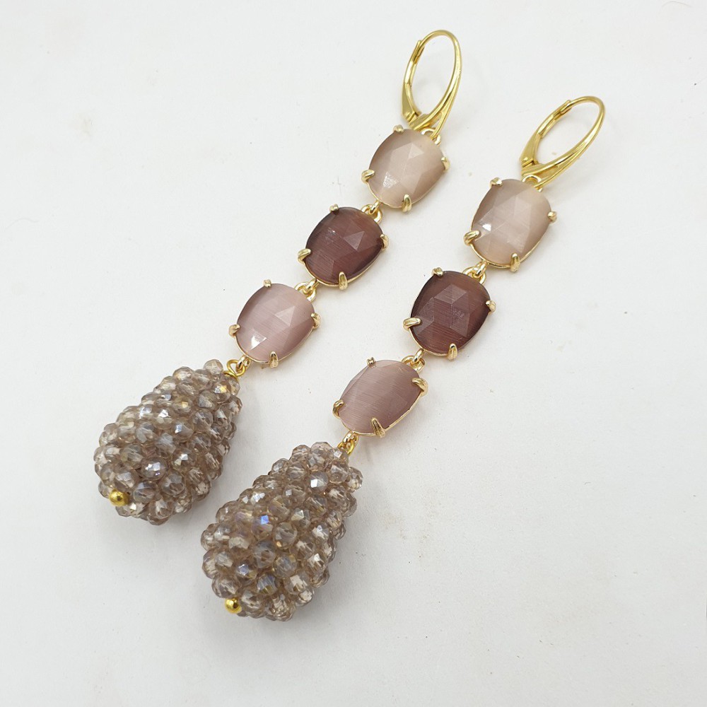 Gilded earrings with cat's eye and drop of crystals