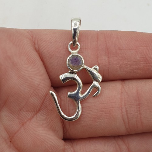 Silver pendant with ohm...