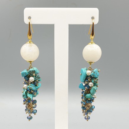 Gilded earrings with moonstone and blue Howliet