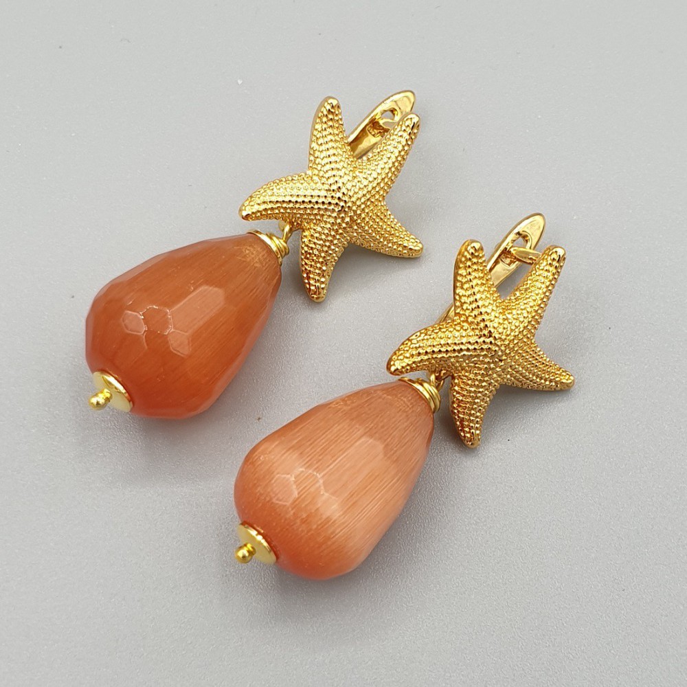 Gilt earrings with orange cat eye drop