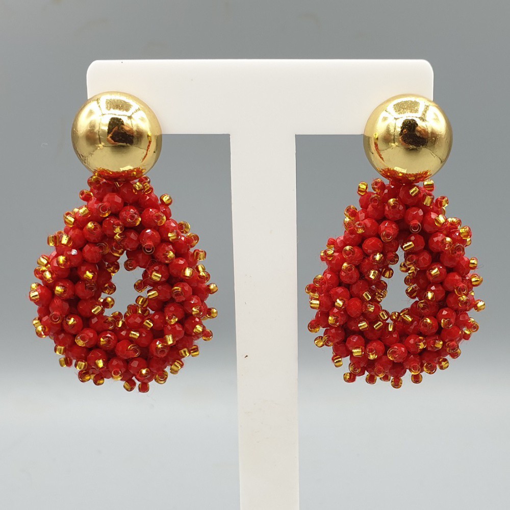 Gilt earrings open drops of red crystals