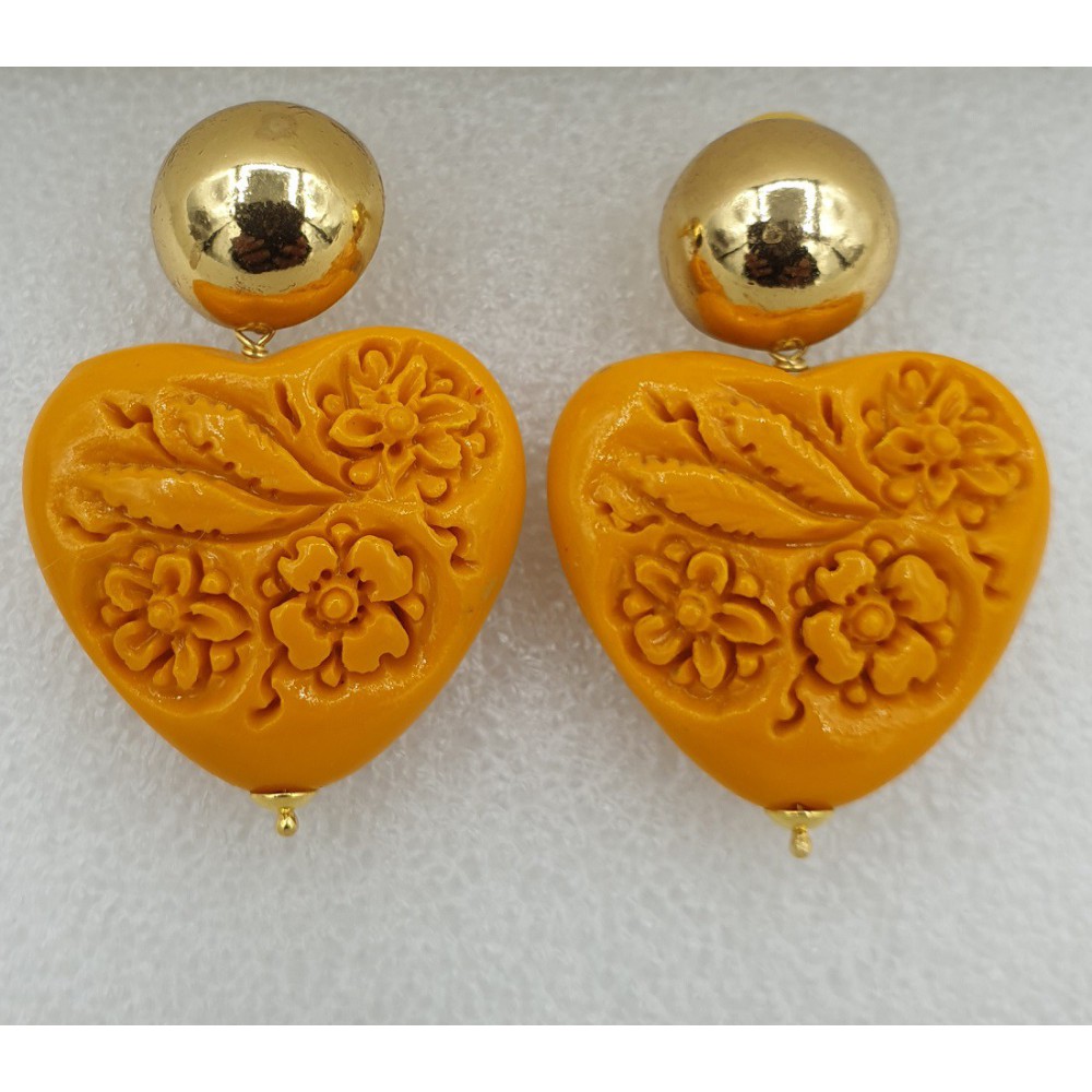 Gilt earrings carved orange resin heart