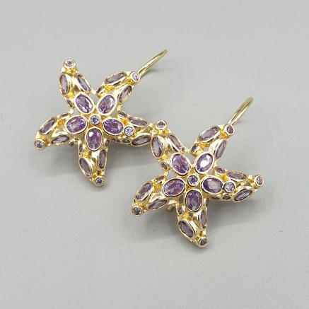 Gilded earrings starfish purple crystals