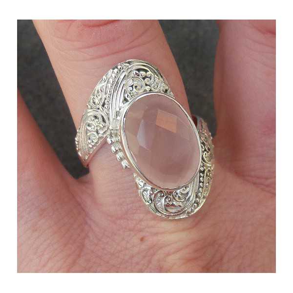 Silver ring set with oval facet cut rose quartz