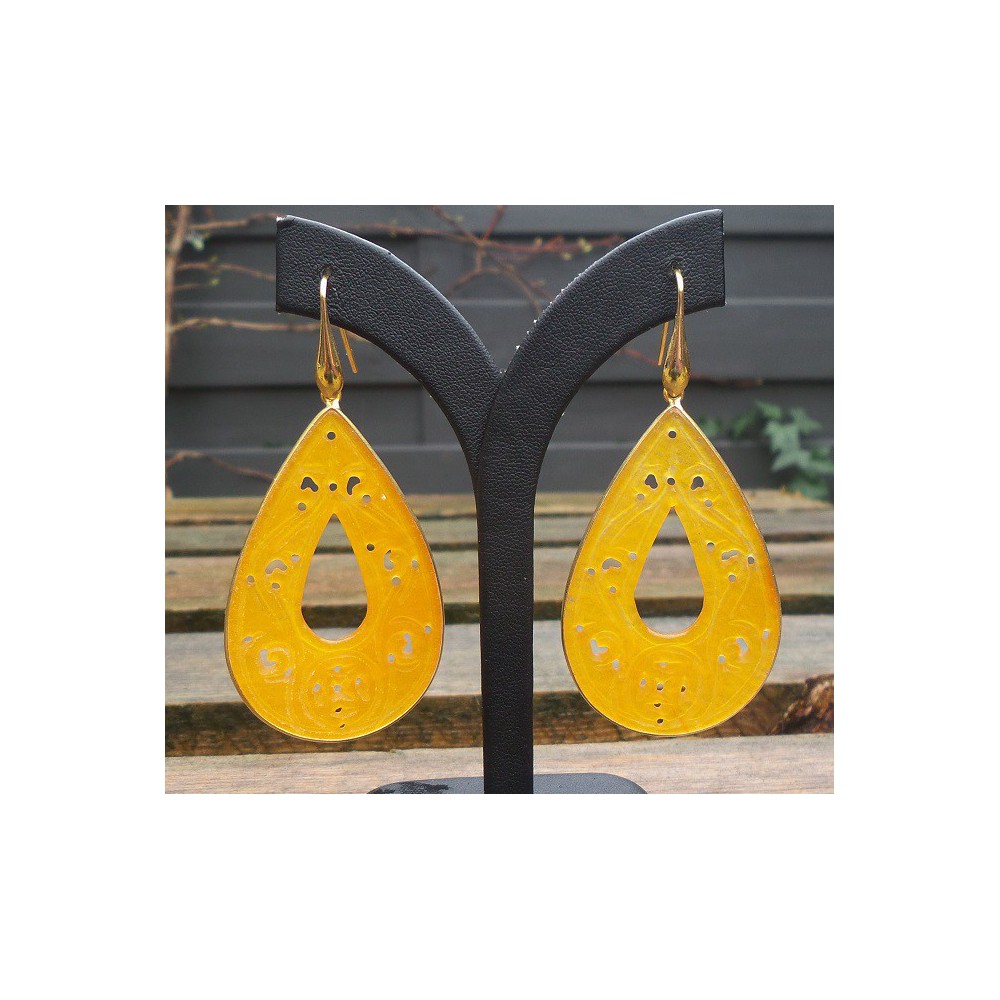 Gilded earrings with large cut orange jade in frame