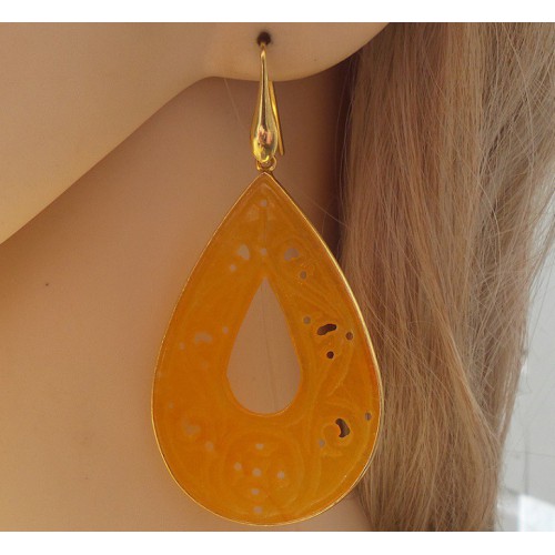 Gilded earrings with large cut orange jade in frame