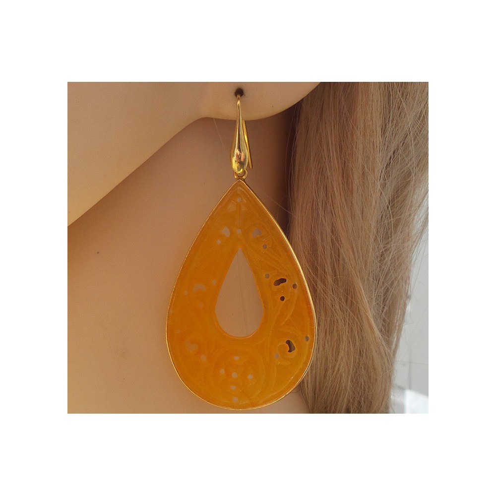 Gilded earrings with large cut orange jade in frame