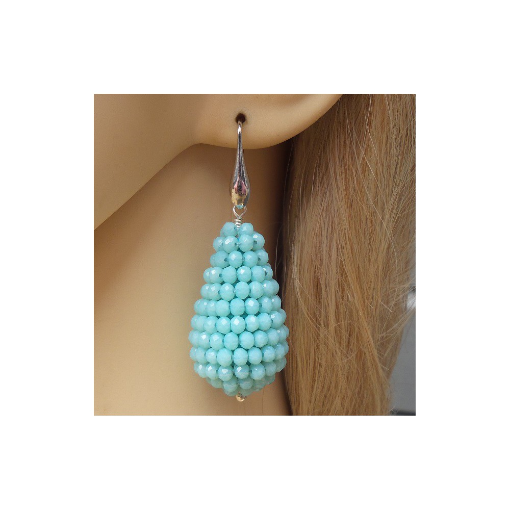 Silver earrings with large drop of light blue crystals