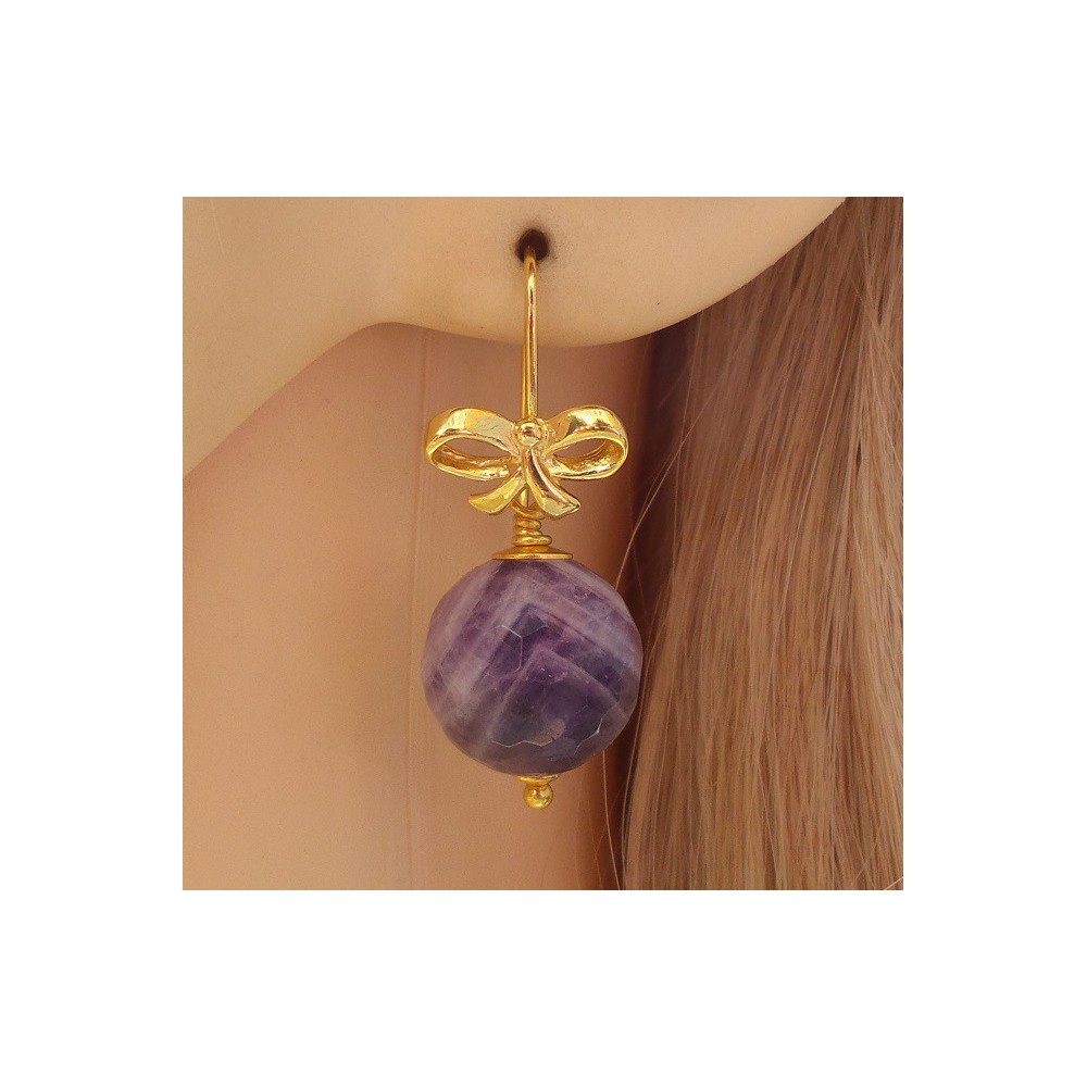 Gilded earrings with facet round amethyst