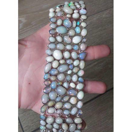 Silver wide bracelet set with Cabochon Ethiopian opals