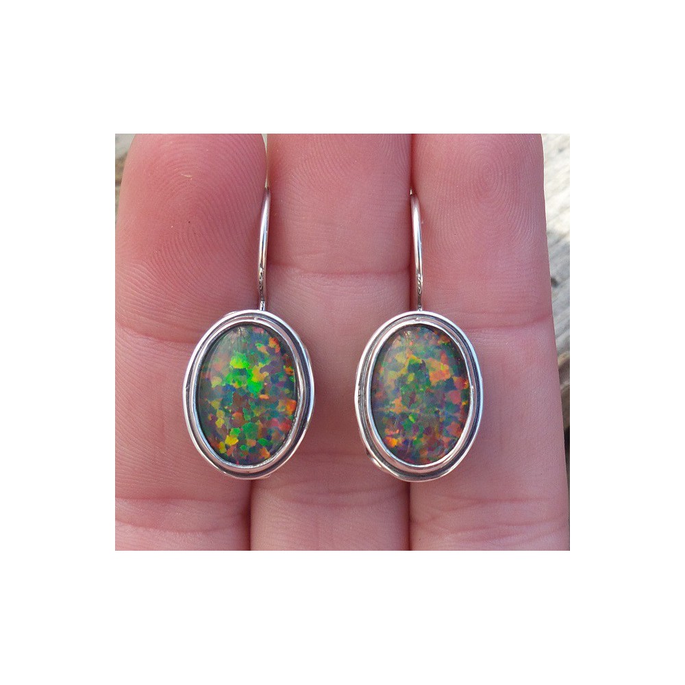 Silver earrings with opal set in edited setting