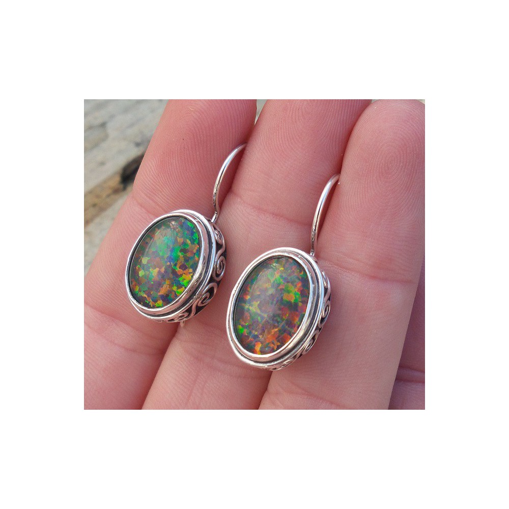 Silver earrings with opal set in edited setting