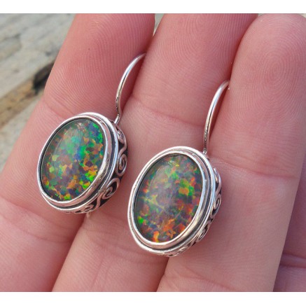 Silver earrings with opal set in edited setting