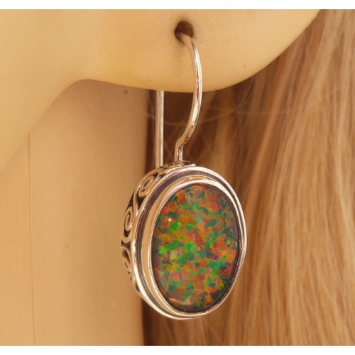 Silver earrings with opal set in edited setting