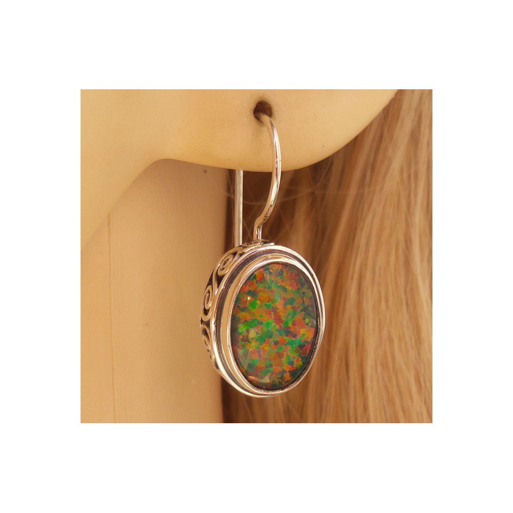 Silver earrings with opal set in edited setting