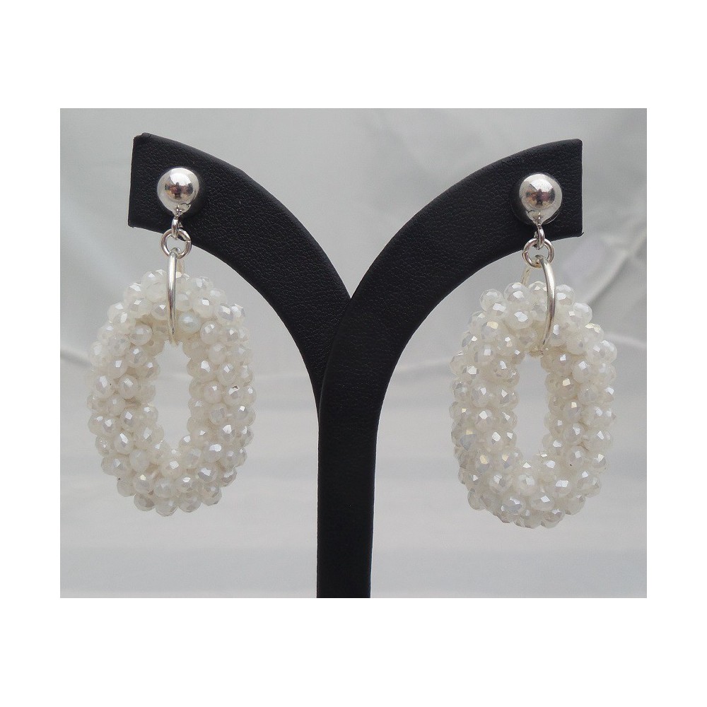 Silver earrings with small oval pendant of white crystals