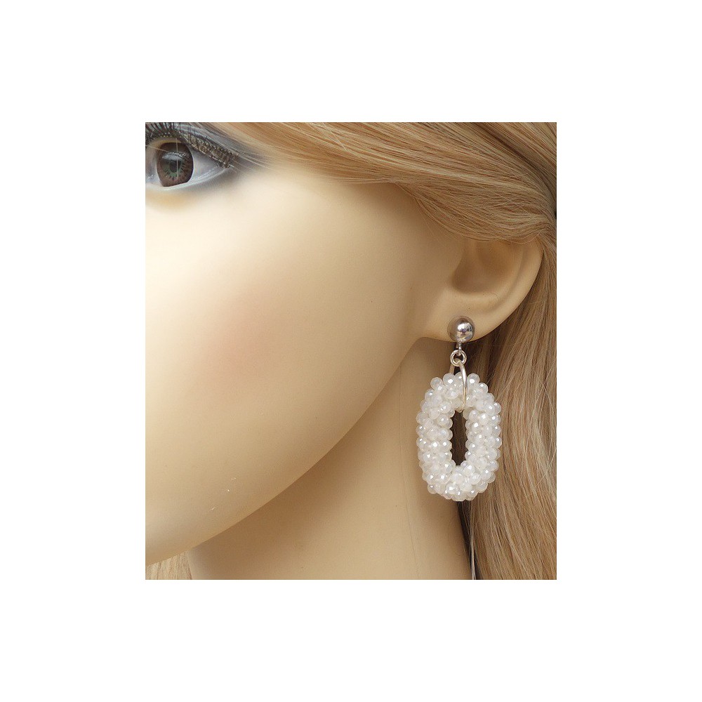 Silver earrings with small oval pendant of white crystals