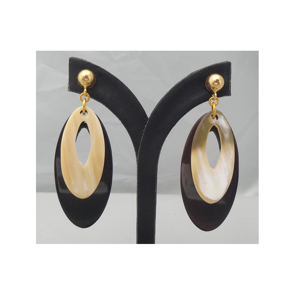 Gilded earrings with oval white and black buffalo horn