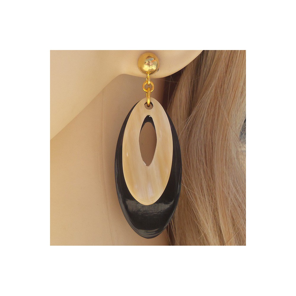 Gilded earrings with oval white and black buffalo horn