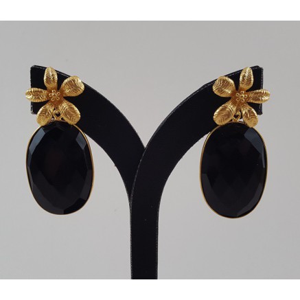 Gold gilded earrings set with oval facet black onyx