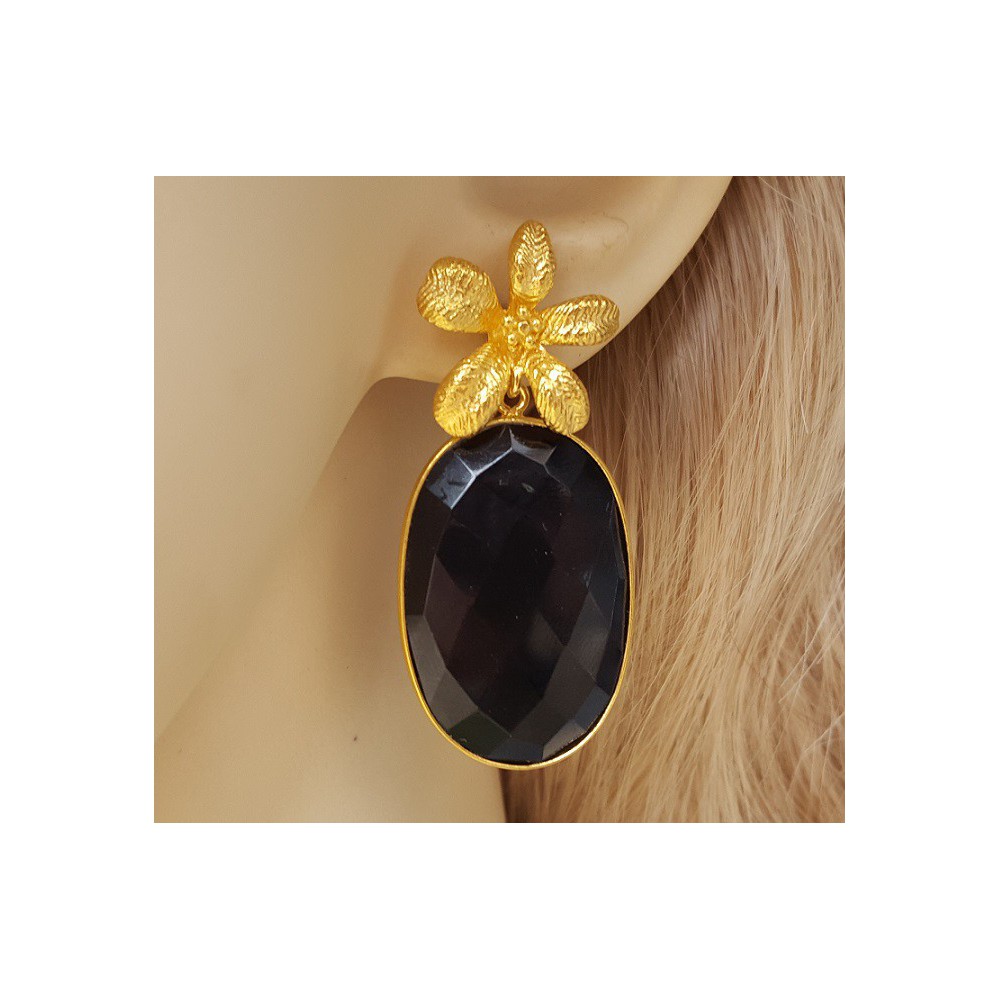 Gold gilded earrings set with oval facet black onyx