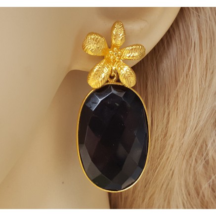 Gold gilded earrings set with oval facet black onyx