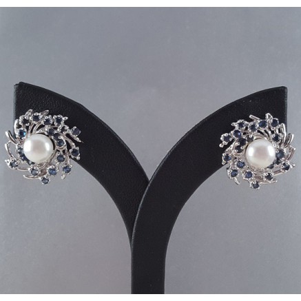 Silver earrings set with sapphires and pearl