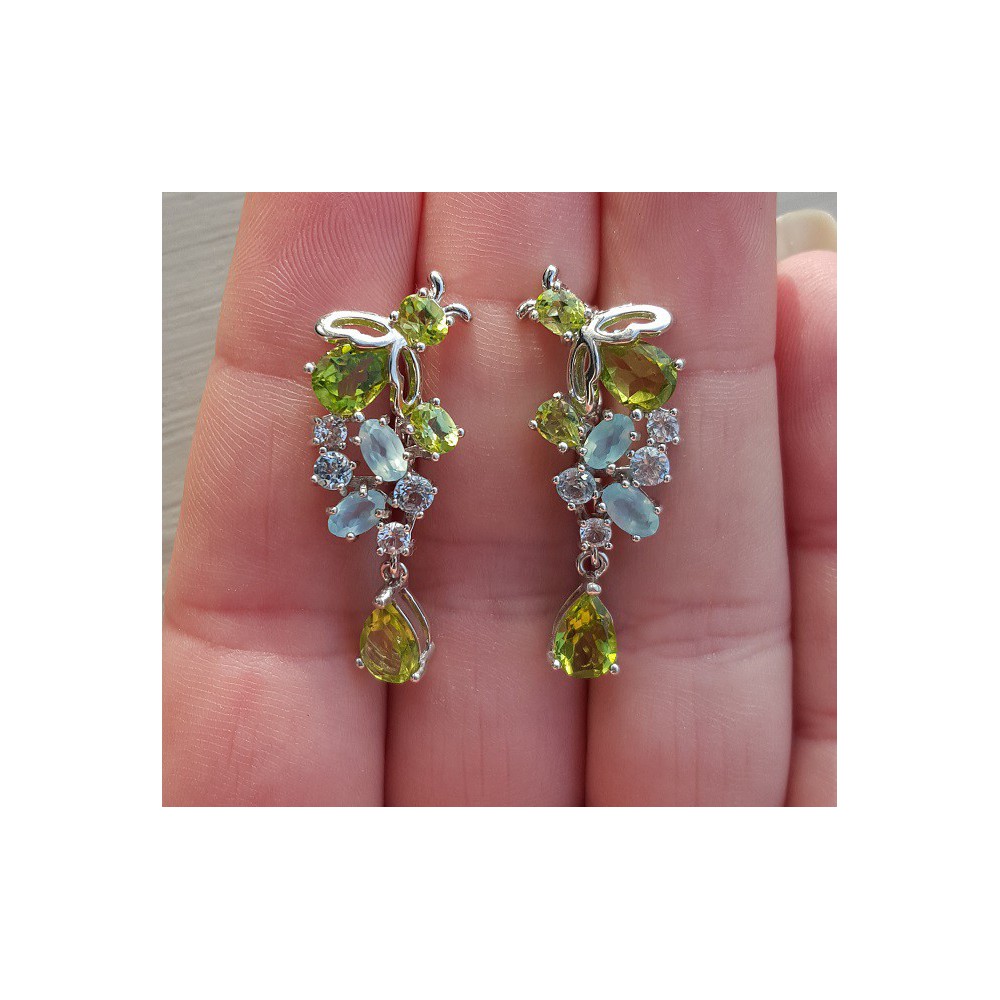 Silver earrings set with peridot, blue topaz and chalcedone